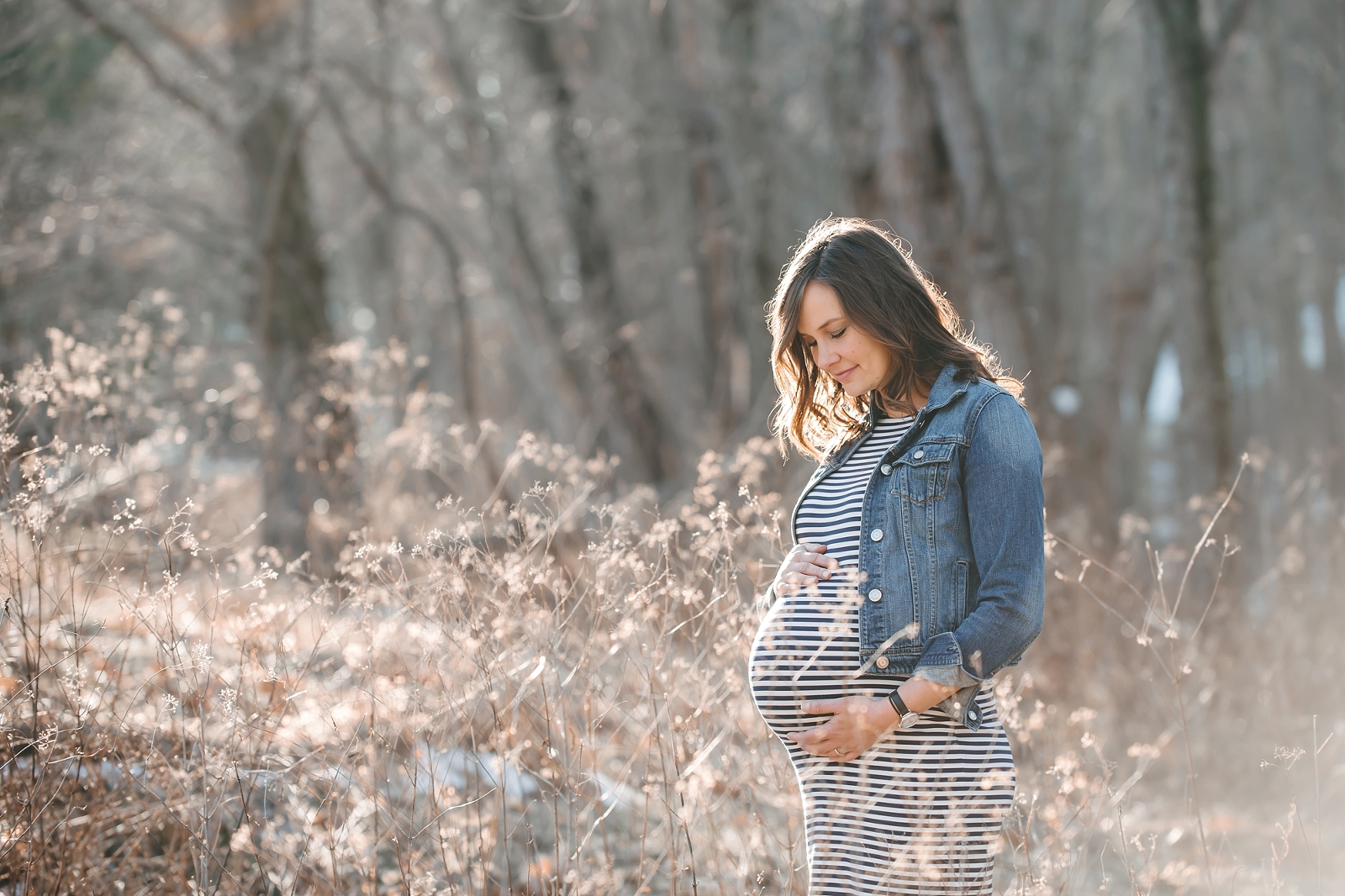 Pregnant woman standing in field at North Park near Pittsburgh