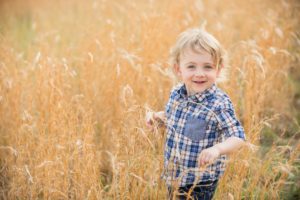 Little boy standing in field in Moon Township near Pittsburgh