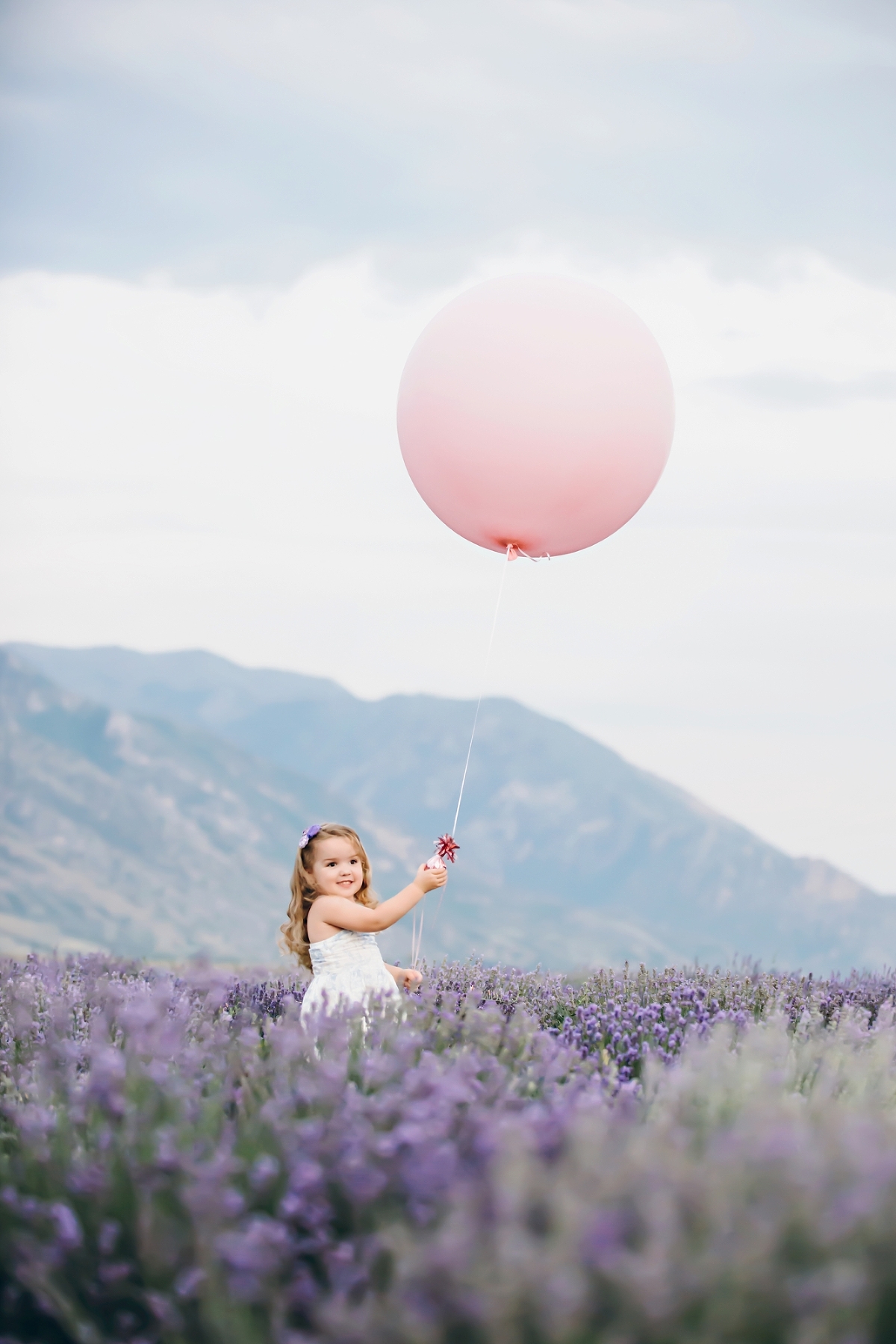 Child holding balloon in lavender field in Pittsburgh