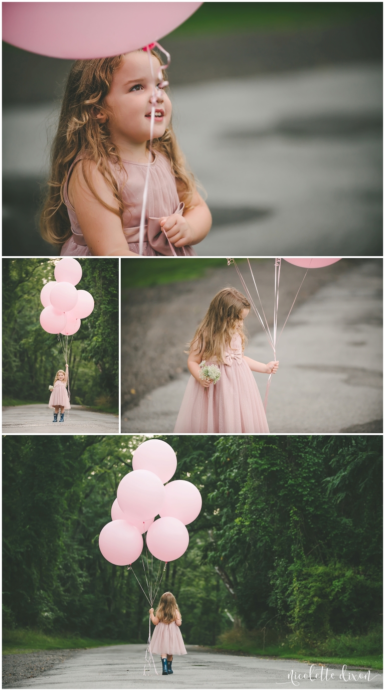 Girl walking in street with balloons in Sewickley Heights Borough Park near Pittsburgh