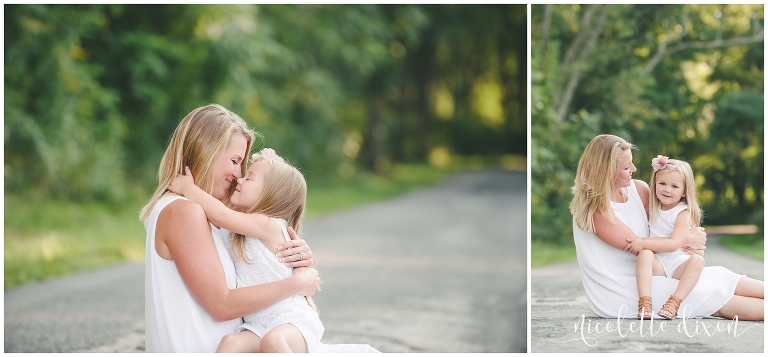 Daughter and mom rubbing their noses together on road near Pittsburgh