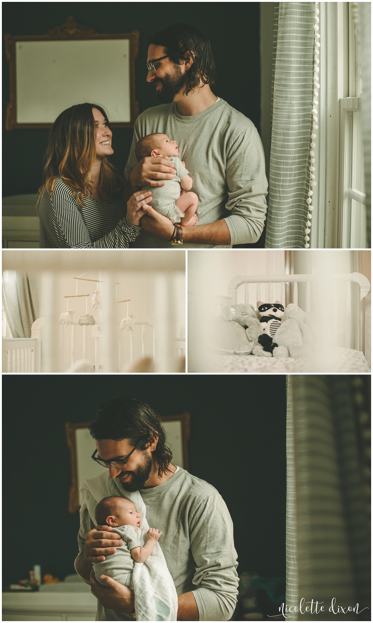 Mom and dad in home looking at each other while holding her newborn baby near Pittsburgh