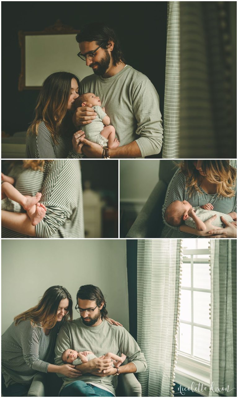 Mom and dad holding newborn baby in home near Pittsburgh