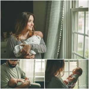 Mom looking out window while holding baby in home near Pittsburgh