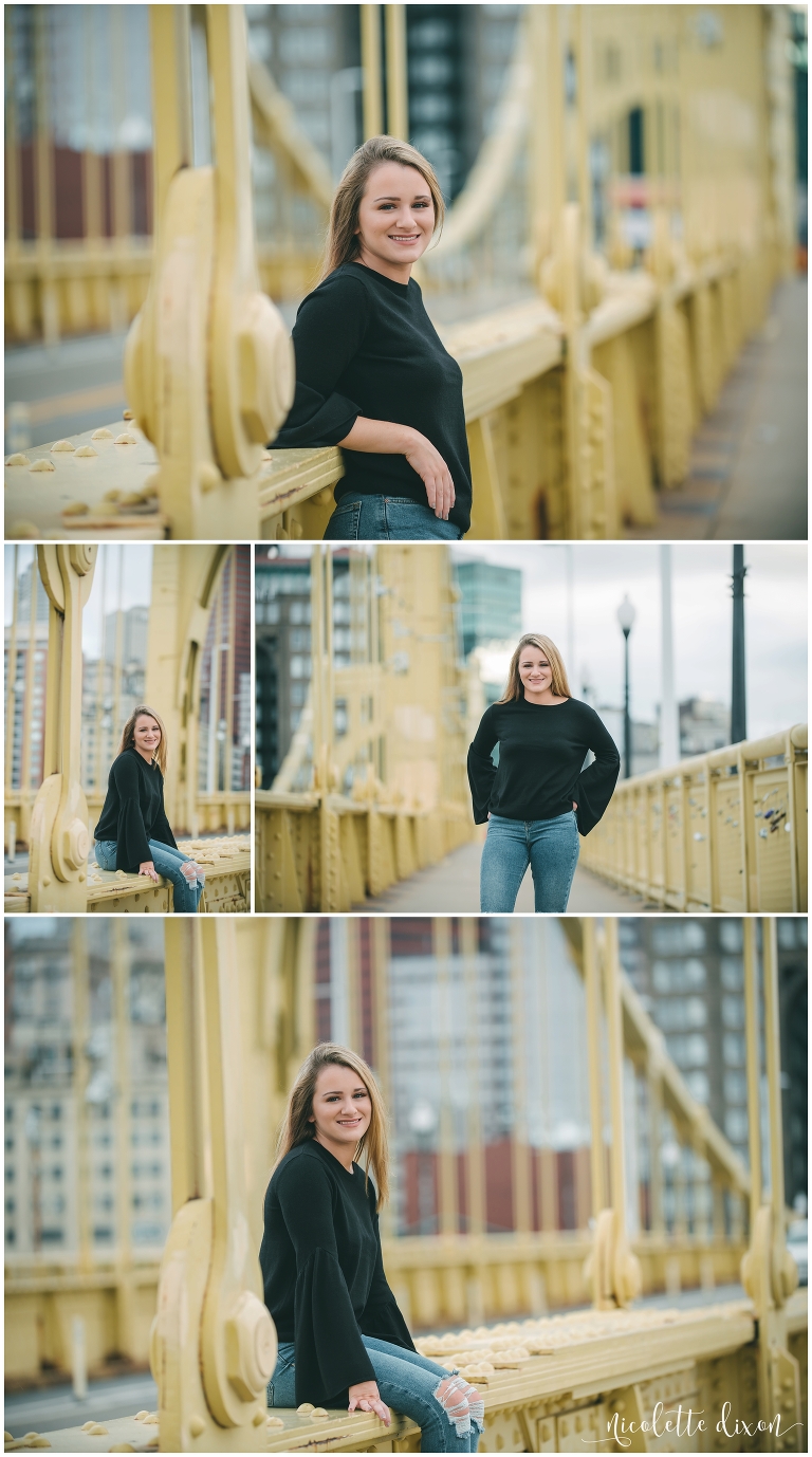 Senior girl standing on bridge in downtown Pittsburgh