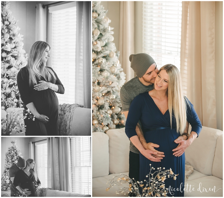 Husband kissing pregnant wife on the cheek in their living room in their home in Sewickley near Pittsburgh