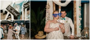 Bride and groom in photo booth at beach wedding
