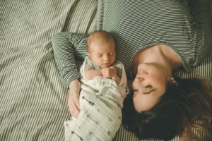 Mom holding newborn baby boy in home in Coraopolis near Pittsburgh