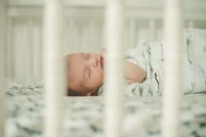 Newborn baby boy laying in crib in home in Coraopolis near Pittsburgh