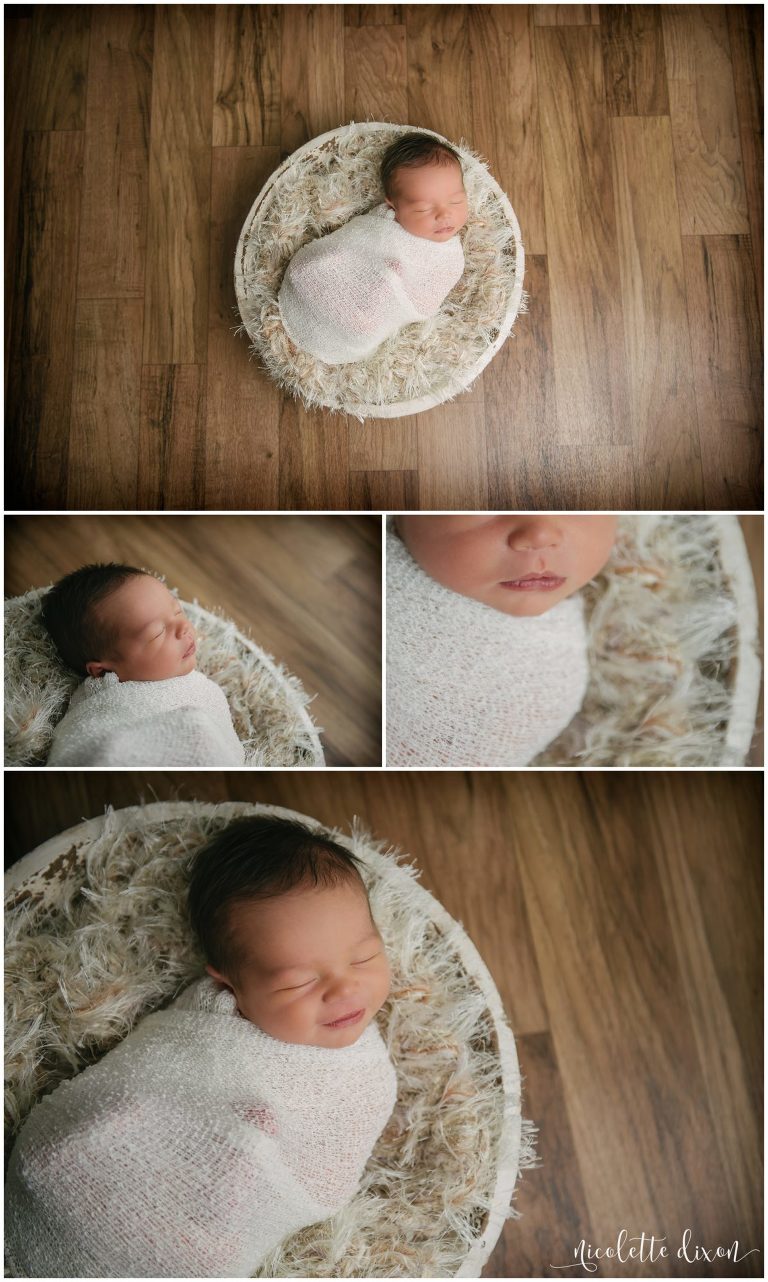 Infant baby boy laying in cream bowl at photography studio in Moon Township near Pittsburgh