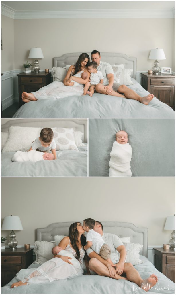 Picture of family looking at newborn baby boy on bed in home in South Fayette near Pittsburgh