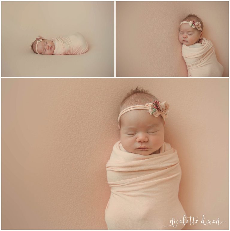 Newborn baby girl poses in wrap and headband at in home studio in Moon Township near Pittsburgh