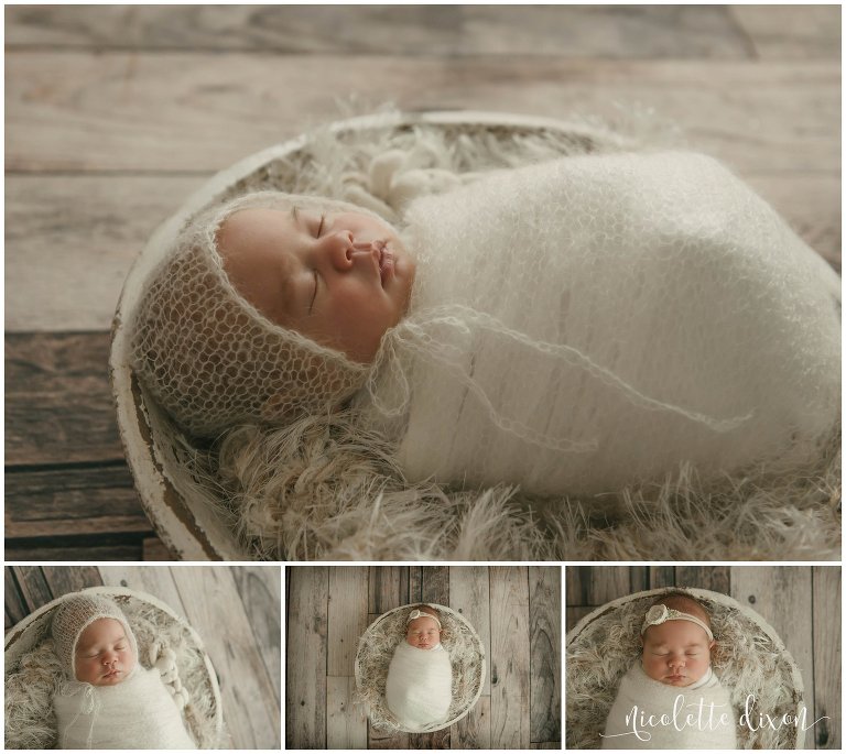 Newborn baby girl sleeps in a basket wearing a wrap, bonnet and headband in in home studio in Moon Township near Pittsburgh