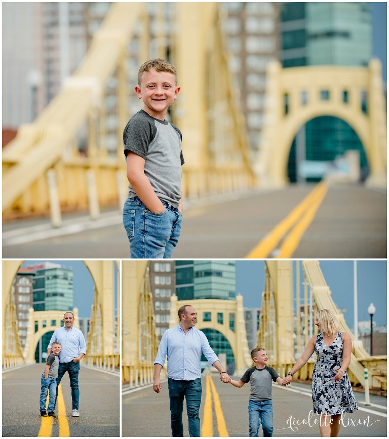 Family walking on Roberto Clemente Bridge in Downtown Pittsburgh