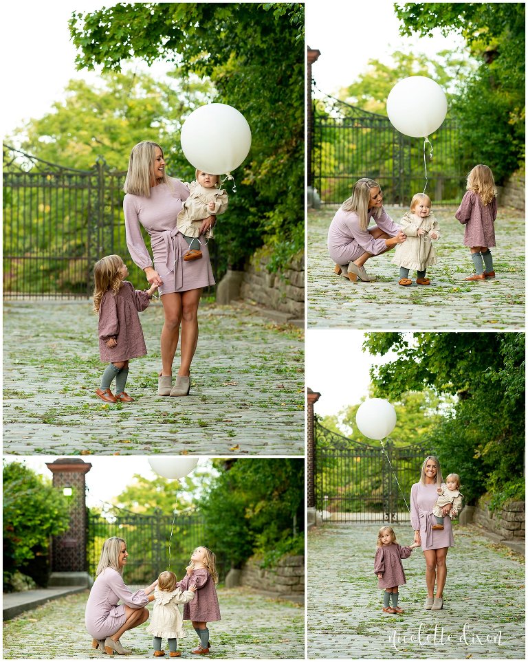 Mom playing with a ballon with her daughters at Mellon Park near Pittsburgh
