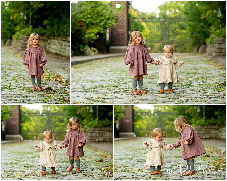 Sisters wearing cream and mauve dresses on a cobblestone road at Mellon Park near Pittsburgh
