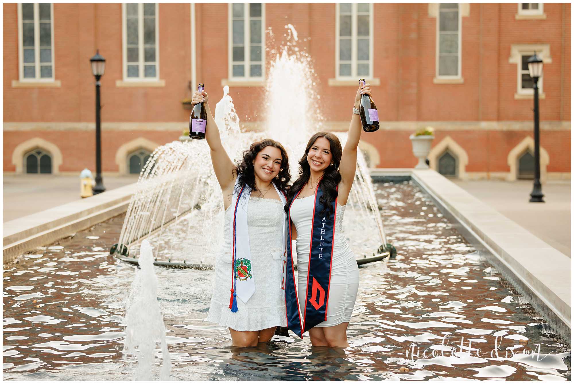 College Graduates Holding up Champagne Bottles in Fountain on Duquesne University Campus in Pittsburgh