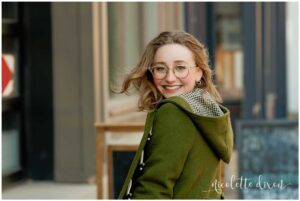 High School Senior Girl Looking Over Shoulder on Street in Carnegie near Pittsburgh PA