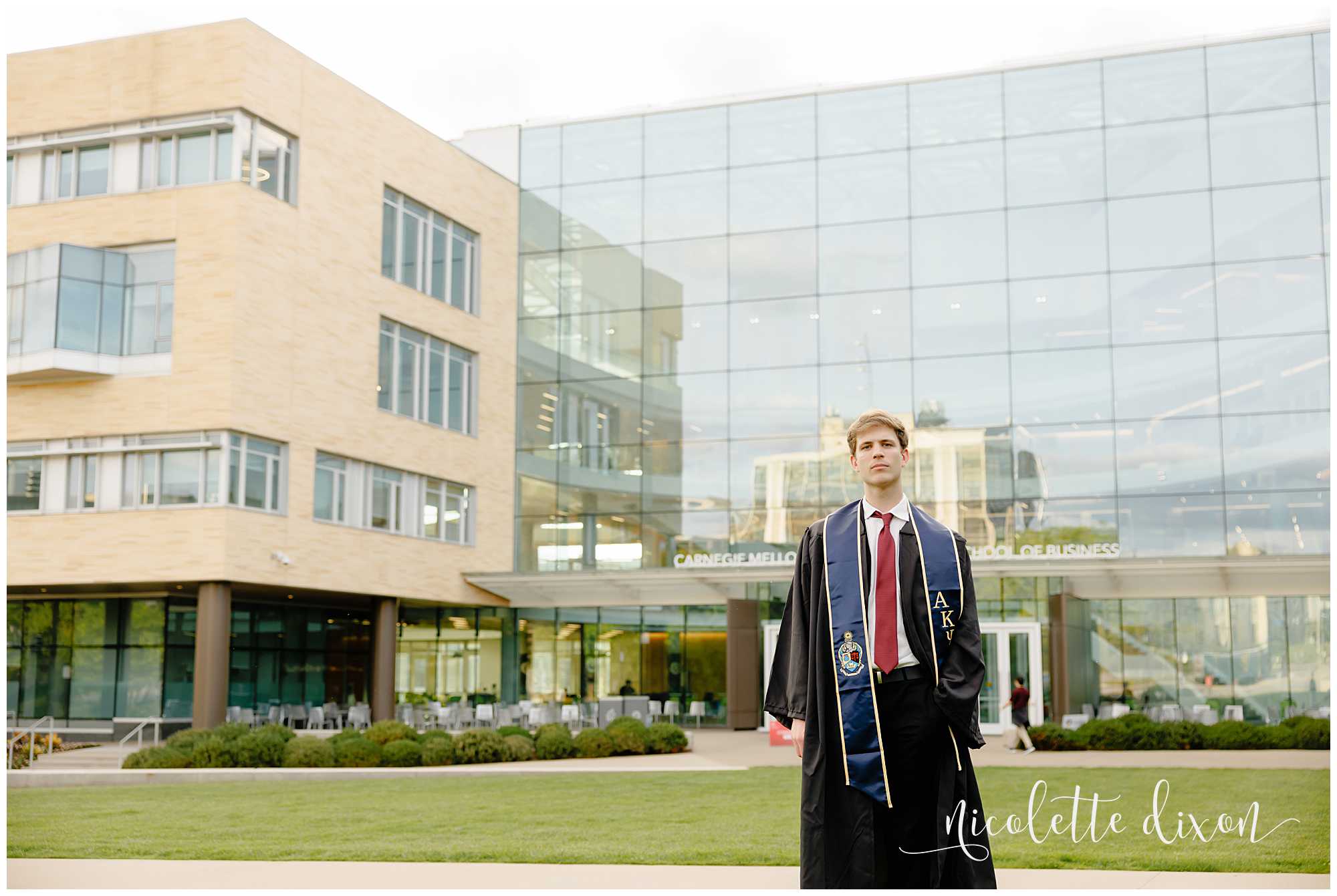 College Graduate Standing in Front of Tepper School of Business at Carnegie Mellon University in Pittsburgh PA