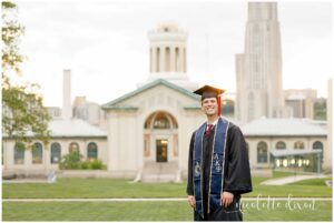 College Graduate Wearing Cap and Gown in Front of Hamerschlag Hall at Carnegie Mellon University in Pittsburgh PA
