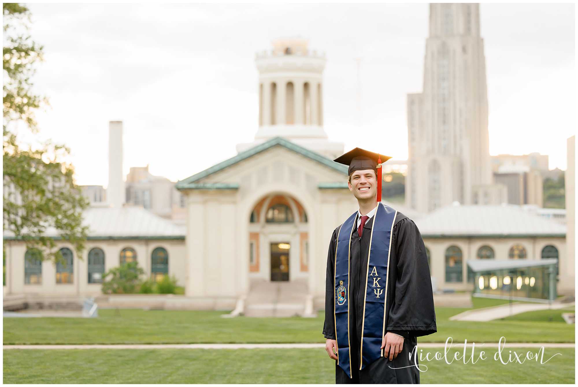 College Graduate Wearing Cap and Gown in Front of Hamerschlag Hall at Carnegie Mellon University in Pittsburgh PA