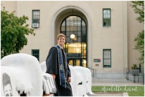 College Graduate Leaning Against the Fence at Carnegie Mellon University in Pittsburgh PA